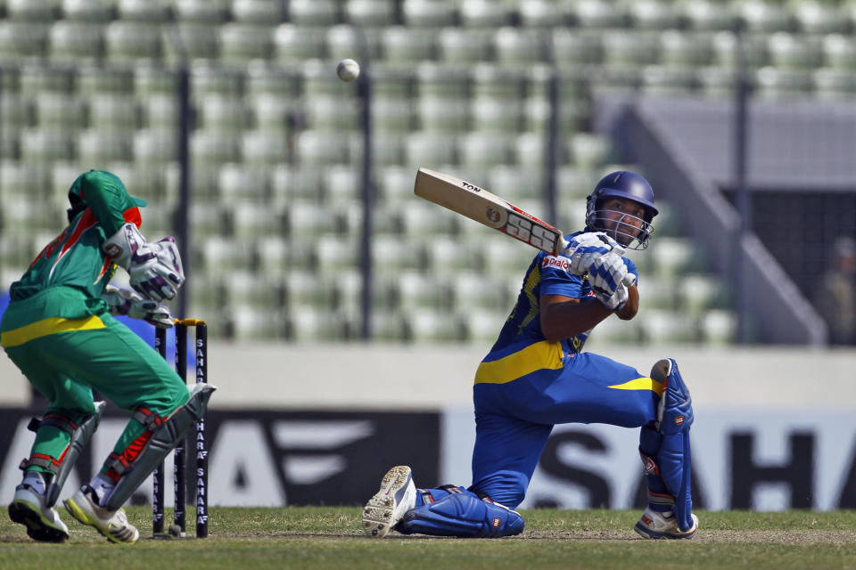 Sri Lanka’s Kumar Sangakkara plays a shot during the second one day international (ODI) cricket match against Bangladesh in Dhaka, Bangladesh, Thursday, Feb. 20, 2014. (AP Photo/A.M. Ahad)