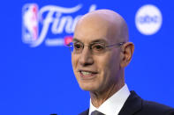 FILE - NBA Commissioner Adam Silver talks to reporters before Game 1 of basketball's NBA Finals between the Boston Celtics and the Dallas Mavericks, Thursday, June 6, 2024, in Boston. The NBA has agreed to terms on its new media deal, an 11-year agreement worth $76 billion that assures player salaries will continue rising for the foreseeable future and one that will surely change how some viewers access the game for years to come. (AP Photo/Charles Krupa, File)