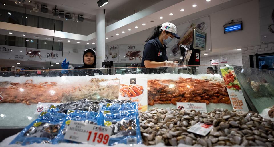 Workers at a seafood store.