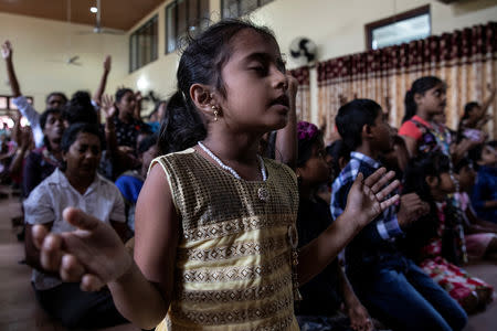 Members of Zion Church, which was bombed on Easter Sunday, pray at a community hall in Batticaloa, Sri Lanka, May 5, 2019. REUTERS/Danish Siddiqui