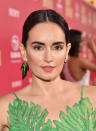 <p>De la Reguera posed on the red carpet at the Los Angeles premiere for <em>Baby Driver</em> sporting a center-parted updo, bold brows, dewy skin, and matte peach lipstick. (Photo: Alberto E. Rodriguez/Getty Images) </p>