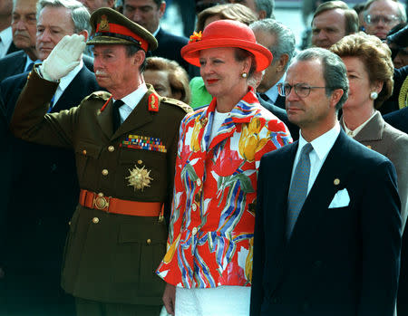 FILE PHOTO: From L-R: Luxembourg's Grand Duke Jean, Denmark's Queen Margrethe II, and Sweden's King Carl XVI Gustav seen at ceremonies to mark the 50th anniversary of the end of World War II in Europe, May 8, 1995. REUTERS/Philippe Wojazer/File Photo