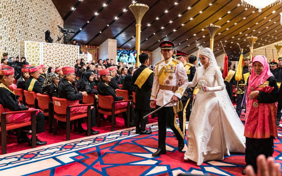 Prince Abdul Mateen and Yang Mulia Anisha Rosnah walk down the aisle