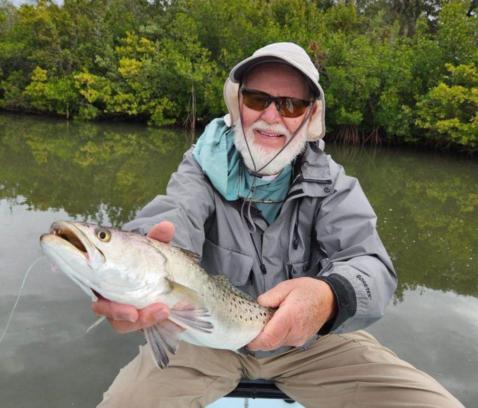 Geno Giza with a lovely trout pulled from the riverside waters of Canaveral National Seashore.