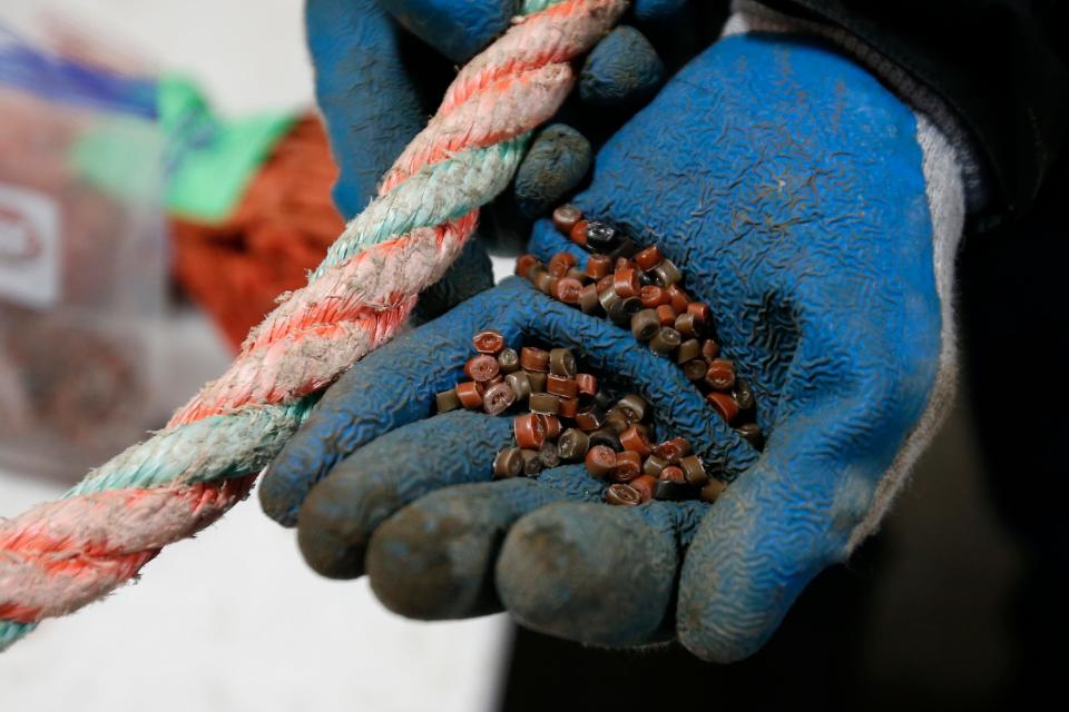 The rope on the left will be recycled into the pellets on the right, which can then be used to create plastic parts from molds.  The nets and ropes are collected by Net your Problem at their warehouse on King Street in New Bedford.