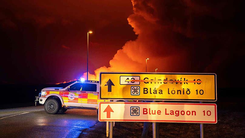 An emergency vehicle is stationed on a road leading to volcanic activity between Hagafell and Stóri-Skógfell, Iceland, on Saturday, March 16, 2024.