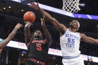 FILE - In this Saturday, Jan. 4, 2020, file photo, Georgia guard Anthony Edwards (5) shoots as Memphis forward Precious Achiuwa (55) defends in the first half of an NCAA college basketball game, in Memphis, Tenn. Edwards is expected to be the first shooting guard taken and possibly the No. 1 overall pick in the NBA draft on Nov. 18, 2020. (AP Photo/Karen Pulfer Focht, File)