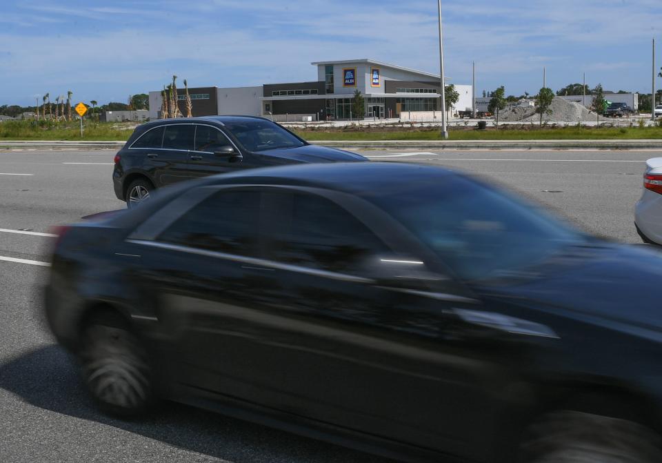 Traffic along Okeechobee Road passes by an Aldi grocery store under development on Wednesday, Sept. 6, 2023, in Fort Pierce. Aldi and Chipotle are new businesses under development along the busy corridor of Okeechobee Road near I-95, where the Fort Pierce Police sees more calls for service as the area continues to grow.