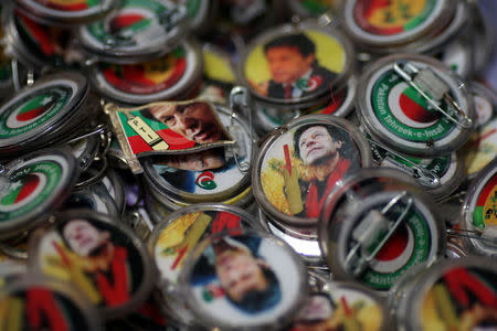 Pins with images of Imran Khan, leader of the Pakistan Tehreek-e-Insaf (PTI), are pictured at a market a day after general election in Islamabad, Pakistan, July 26, 2018. REUTERS/Athit Perawongmetha