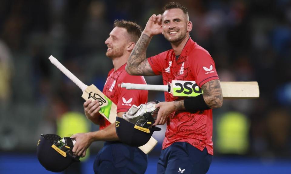 England’s Jos Buttler and Alex Hales walk from the field after the T20 World Cup cricket semi-final against India