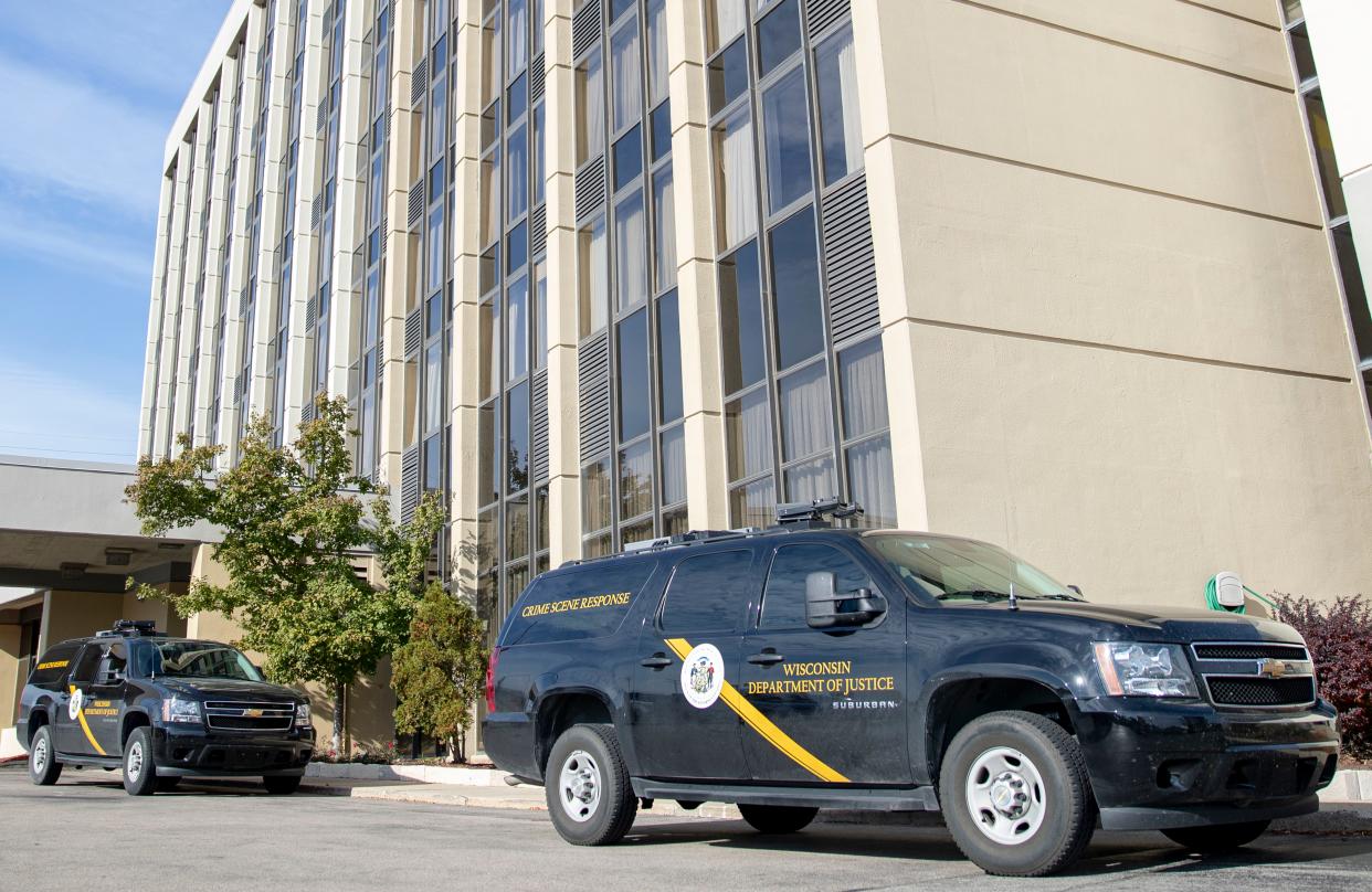 Wisconsin Department of Justice crime scene response vehicles a parked in front of the Radisson Hotel in Wauwatosa.