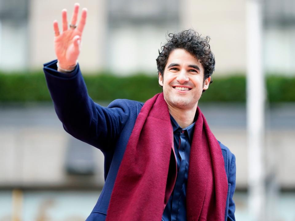 Criss waving outside.