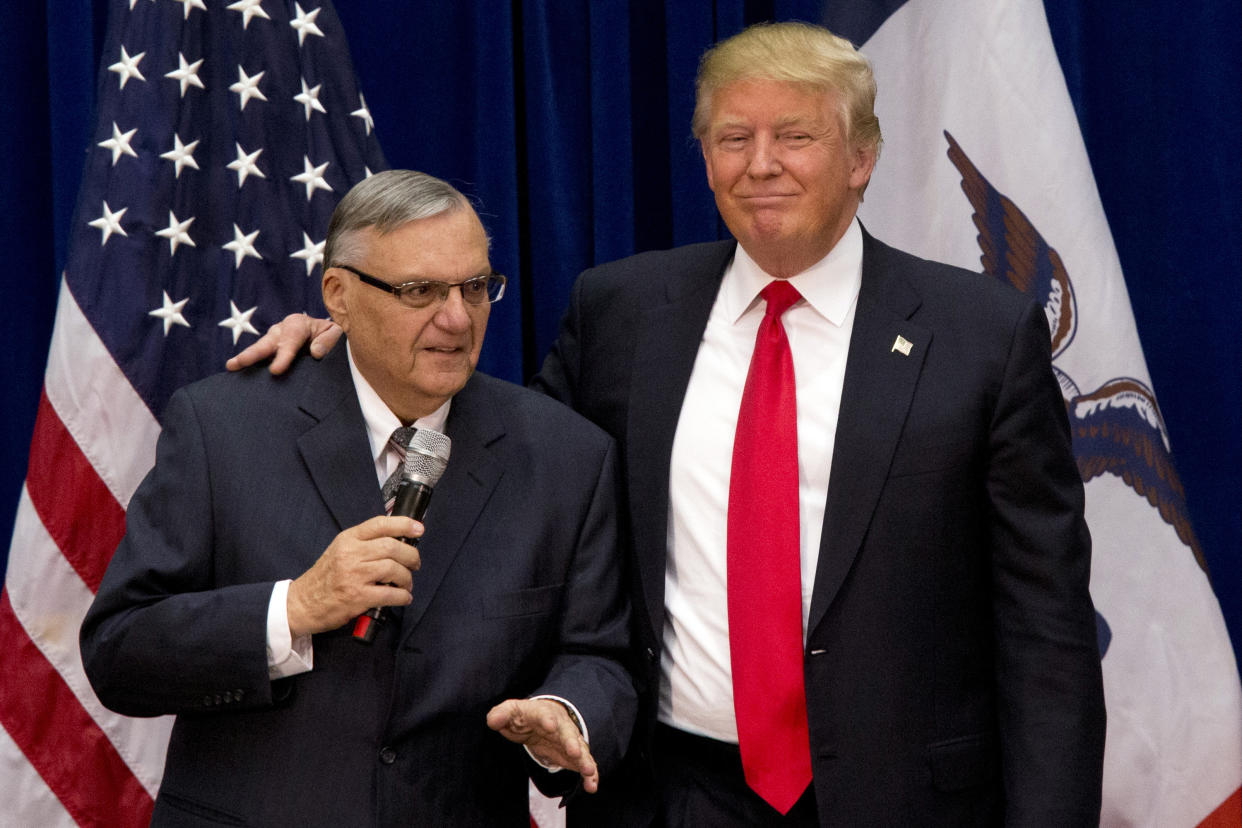 In this 2016 photo, Donald Trump is joined by Maricopa County, Ariz., Sheriff Joe Arpaio at an Iowa campaign event. Trump says he may grant a pardon to Arpaio following his recent conviction in federal court. (AP Photo/Mary Altaffer, File)