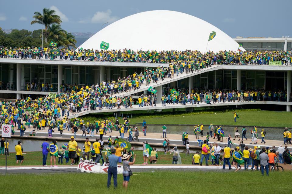 Protesters, supporters of Brazil's former President Jair Bolsonaro, storm the the National Congress building in Brasilia, Brazil, Sunday, Jan. 8, 2023. 