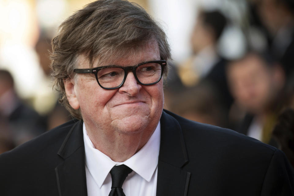 FILE - This May 25, 2019 file photo shows Michael Moore at the awards ceremony of the 72nd international film festival, Cannes, southern France. In "Planet of the Humans," which premiered Wednesday, July 31, at the Traverse City Film Festival, he and director Jeff Gibbs pull the curtain back on the false promises of alternative energy, from electric cars to windmills and biomass, and expose why they're not working. (Photo by Vianney Le Caer/Invision/AP, File)