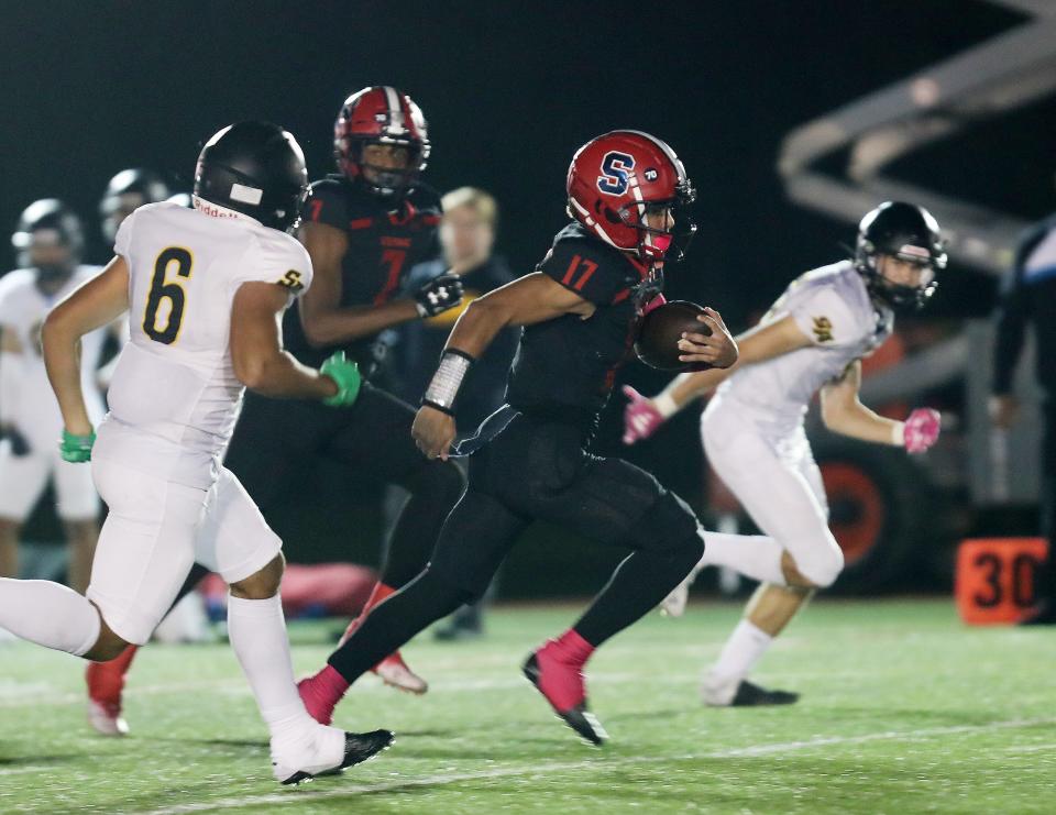 Stepinac's Troy Worrell (17) looks for some running room in Saint Anthony's defense as he runs for a first half touchdown during football action at Archbishop Stepinac High School in White Plains Oct. 27, 2023.