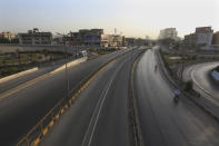 Roads are deserted due to a lockdown to help control the spread of the coronavirus, in Karachi, Pakistan, Sunday, May 9, 2021. (AP Photo/Fareed Khan)