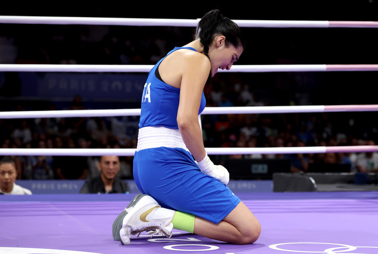 PARIS, FRANCE - AUGUST 01: Angela Carini of Team Italy reacts after abandoning the Women's 66kg preliminary round match against Imane Khelif of Team Algeria in the first round on day six of the Olympic Games Paris 2024 at North Paris Arena on August 01, 2024 in Paris, France. (Photo by Richard Pelham/Getty Images)