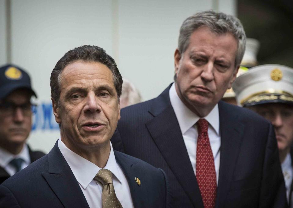 FILE - This photo from Wednesday, Oct. 24, 2018, shows Mayor Bill de Blasio right, and Gov. Andrew Cuomo, left, holding a news conference in New York. De Blasio said he watched the CBS interview Thursday with Cuomo accuser Charlotte Bennett and said he found her 