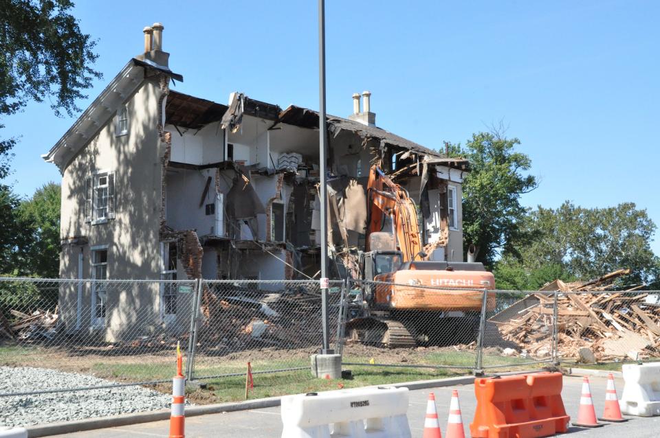 Demolition is underway Wednesday, Sept. 20, 2023, on the back of the Scull mansion on State Street in Dover where a parking lot is planned for Bayhealth Hospital's Kent Campus. Built in 1863, the mansion was listed on the National Register of Historic Places in 1973.