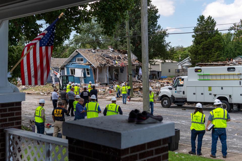 Multiple agencies investigate the scene the morning after a house explosion in the 1000 block of North Weinbach Avenue in Evansville, Ind., Thursday, Aug. 11, 2022.