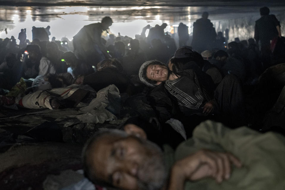 Hundreds of Afghans addicts gather under a bridge to consume drugs, mostly heroin and methamphetamines in the city of Kabul, Afghanistan,Wednesday, June 15, 2022. Drug addiction has long been a problem in Afghanistan, the world’s biggest producer of opium and heroin. The ranks of the addicted have been fueled by persistent poverty and by decades of war that left few families unscarred. (AP Photo/Ebrahim Noroozi)