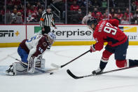 Washington Capitals center Evgeny Kuznetsov (92) scores past Colorado Avalanche goaltender Darcy Kuemper (35) during the first period of an NHL hockey game Tuesday, Oct. 19, 2021, in Washington. (AP Photo/Alex Brandon)