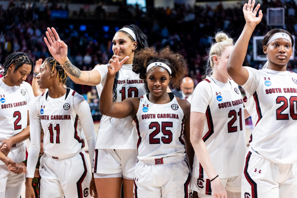 Mar 19, 2023; Columbia, SC, USA; South Carolina Gamecocks center Kamilla Cardoso (10), guard Raven Johnson (25) and forward Sania Feagin (20) wave to fans following their 76-45 victory over the South Florida Bulls at Colonial Life Arena, advancing them to the Sweet 16. Mandatory Credit: Jeff Blake-USA TODAY Sports