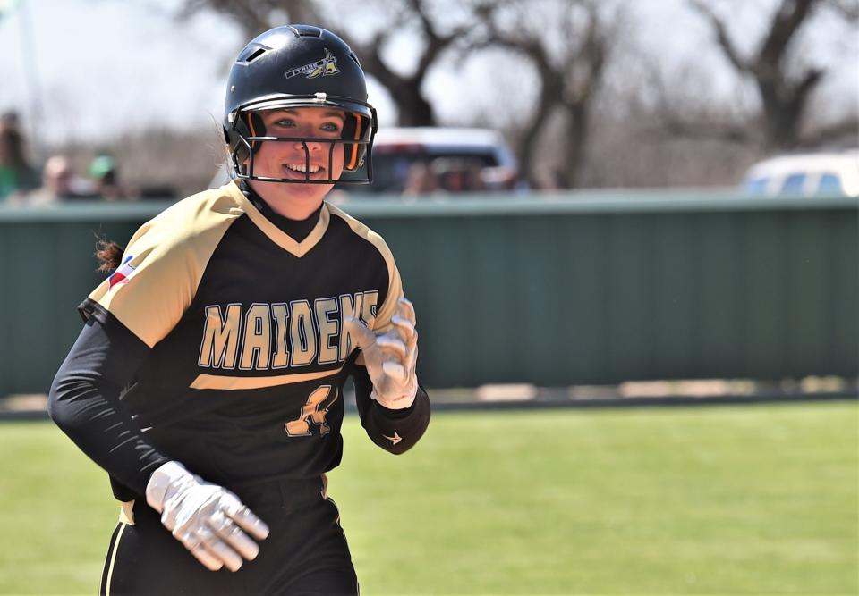 Haskell's Alyssa Stocks is all smiles after rounding second following her three-run home run against Hamlin in a four-run seventh inning.