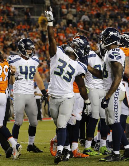 Christine Michael points to the sky after scoring in Thursday's preseason opener (AP)