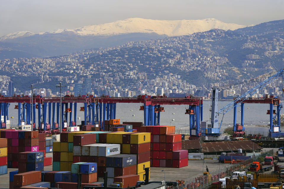 Shipping containers are stacked at the Beirut Port, in Beirut, Lebanon, Wednesday, March 13, 2024. Three and a half years after hundreds of tons of improperly stored ammonium nitrate ignited at the Beirut port, setting off one of the world's biggest non-nuclear explosions, Lebanese and French officials put forward a plan for reconstruction and reorganization of the port Wednesday. (AP Photo/Bilal Hussein)