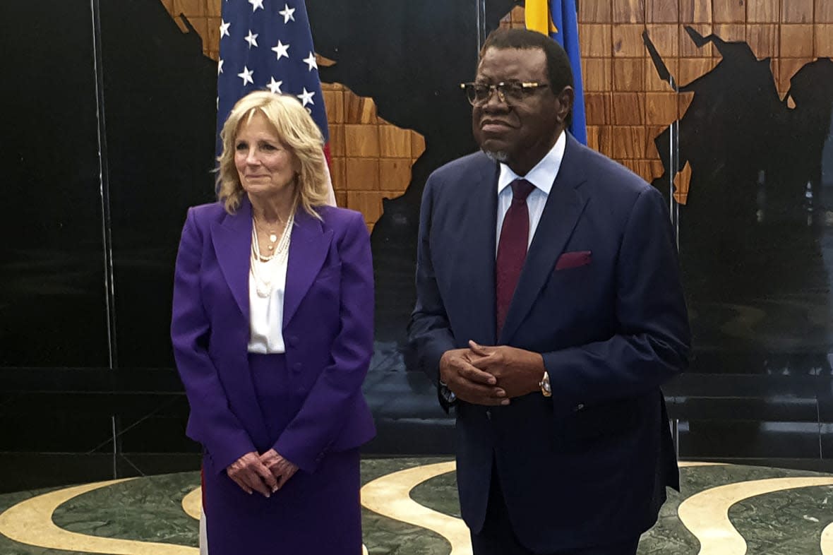 U.S. First Lady Jill Biden, left, with Namibian President Hagers Geingob, right, at State House in Windhoek, Namibia Wednesday, Feb. 22, 2023. Biden is in the country as part of a commitment by President Joe Biden to deepen U.S. engagement with the region. (AP Photo/Dirk Heinrich)