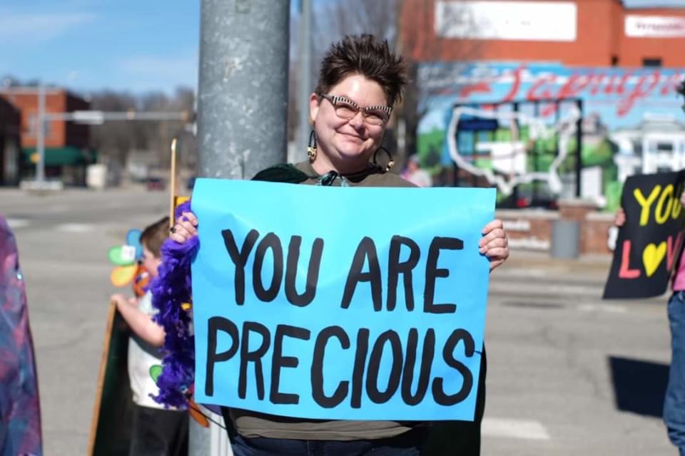 A group of around 25 people gathered last month to hold encouraging signs on a street corner in Sapulpa, Oklahoma. The uplifting efforts are part of the "Stay Another Day: Suicide Prevention and Awareness" mission launched by a suicide attempt survivor dedicated to spreading hope.