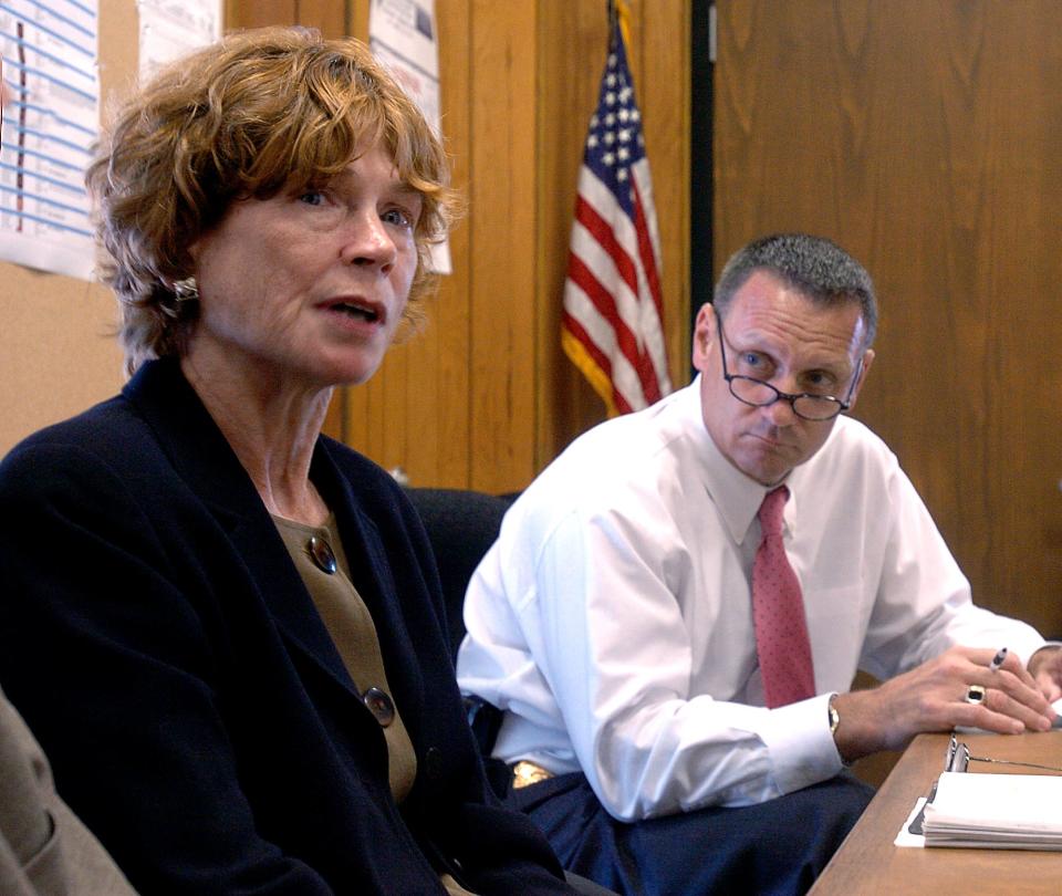 Ginger Navickas, Daybreak director, speaks about domestic violence as Worcester Police Chief Gary G. Gemme listens in 2005.