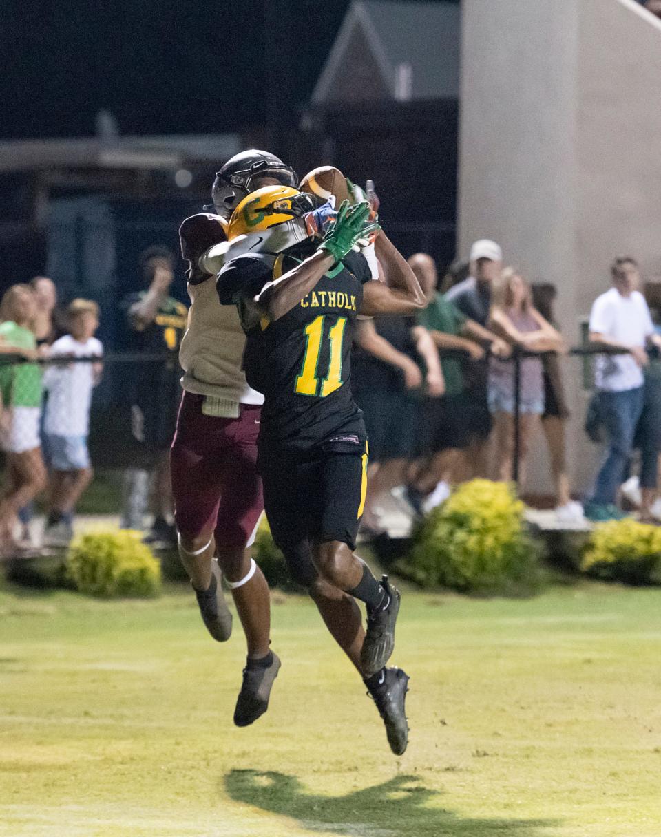 Xavier Thompson (11) breaks up the pass to Carmelo Campbell (2) in the end zone during the Tate vs. Catholic varsity Kickoff Classic at Pensacola Catholic High School on Aug. 19, 2022.