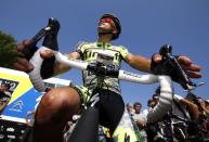 Tinkoff-Saxo rider Alberto Contador of Spain prepares to leave for a training session in Utrecht, Netherlands, July 3, 2015. REUTERS/Eric Gaillard