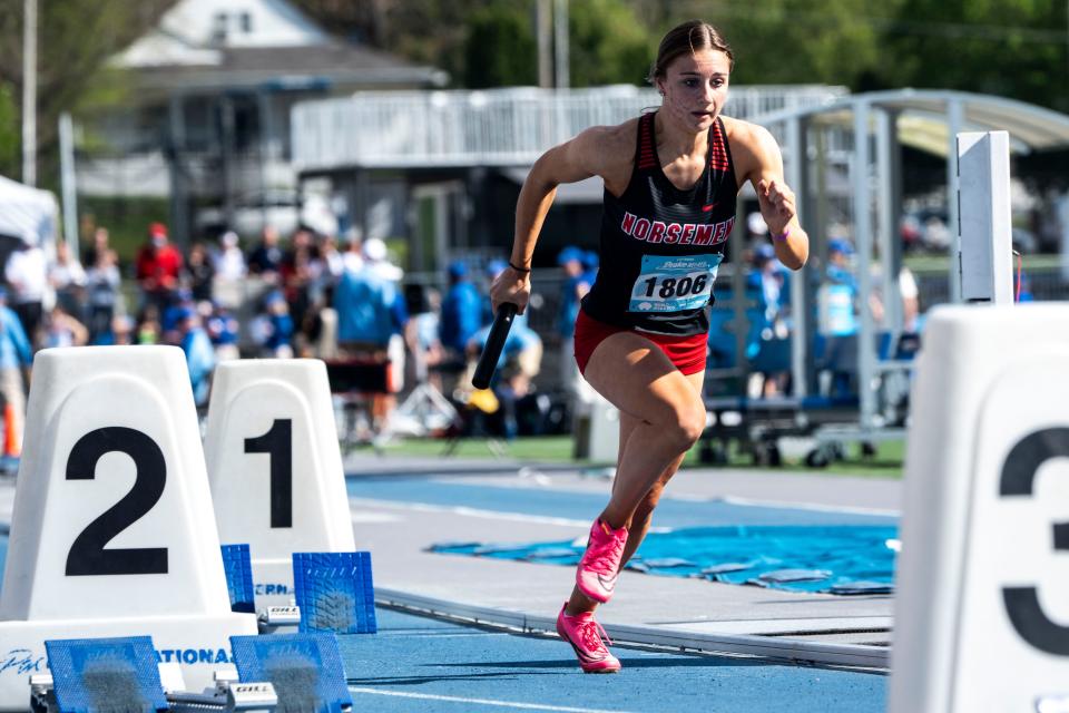 Roland-Story's Adalyn Sporleder runs in the 4x100 relay preliminary races during the Drake Relays at Drake Stadium on Saturday, April 27, 2024, in Des Moines.