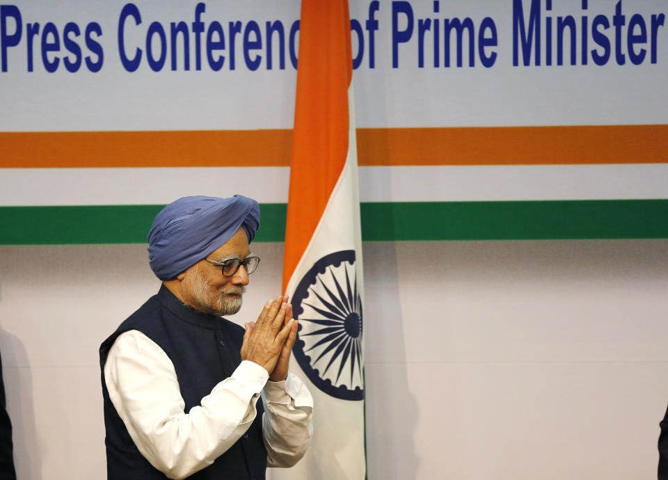Indian Prime Minster Manmohan Singh greets during a press conference, in New Delhi, India, Friday, Jan. 3, 2014. Prime Minister Singh said Friday he would step aside after 10 years in office, paving the way for Rahul Gandhi to take the reins of the world's biggest democracy if his party stays in power in this year's elections. (AP Photo/Harish Tyagi, Pool)