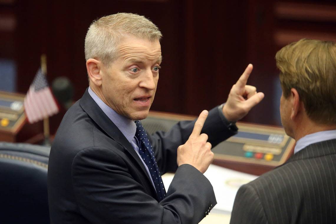 Rep. Paul Renner, R-Palm Coast, left, confers with Rep. Thad Altman, R-Indialantic, prior to the start of a special session on May 19, 2021, in Tallahassee, Fla. Steve Cannon/AP