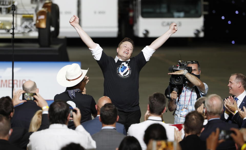 Elon Musk with his hands in the air after the manned SpaceX Falcon 9 Crew Dragon Demo-2 mission lifted off.