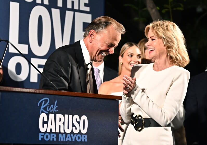 Los Angeles, California June 7, 2022-L.A. Mayoral candidate Rick Caruso and wife Tina share a laugh on election night at the Grove Tuesday night. (Wally Skalij/Los Angeles Times)