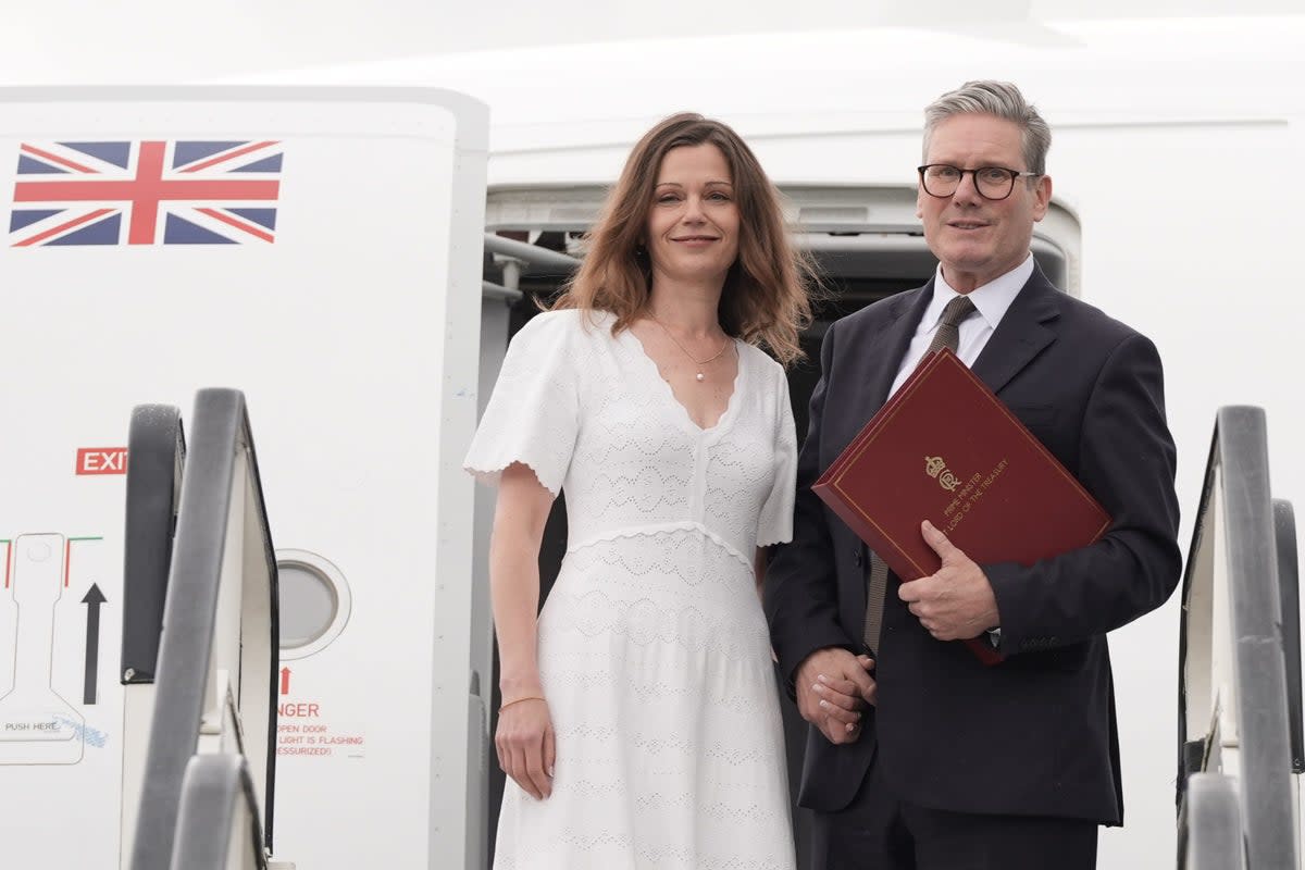 Prime Minister Sir Keir Starmer and his wife Victoria board a plane (Stefan Rousseau/PA) (PA Wire)