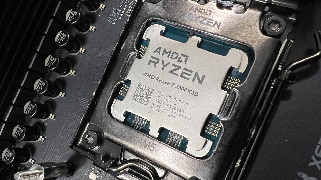  An AMD Ryzen 7 7800X3D slotted into a motherboard. 