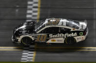 Aric Almirola crosses the finish line to win the second NASCAR Daytona 500 qualifying auto race Thursday, Feb. 16, 2023, at Daytona International Speedway in Daytona Beach, Fla. (AP Photo/Chris O'Meara)