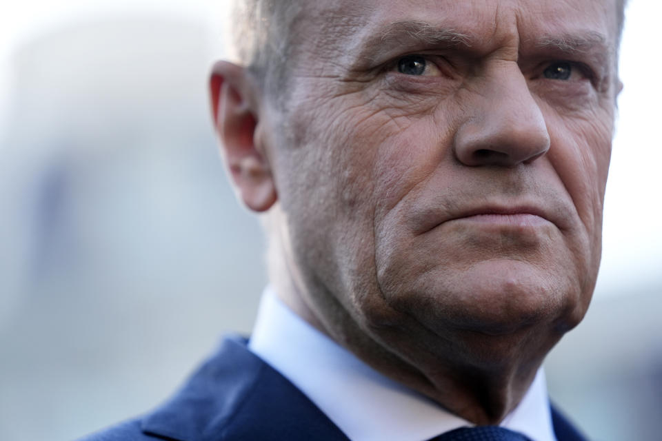 FILE - Polish Prime Minister Donald Tusk talks with reporters outside the West Wing of the White House after meeting with President Joe Biden Tuesday, March 12, 2024, in Washington. Poland’s Prime Minister Donald Tusk on Friday, May 10, 2024 announced changes in his Cabinet to replace four ministers running for the European Parliament next month. (AP Photo/Andrew Harnik, File)