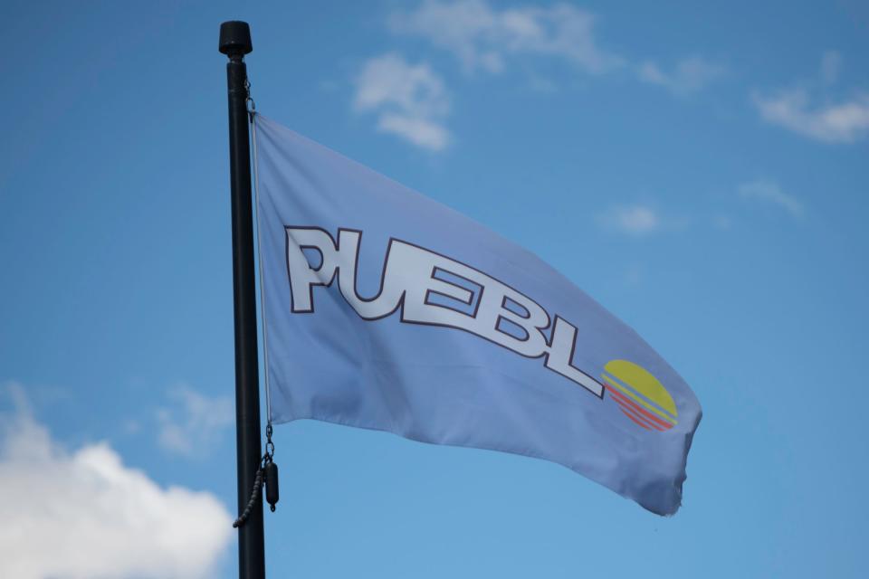 A Pueblo flag blows in the wind along Union Avenue on Tuesday, March 19, 2024.