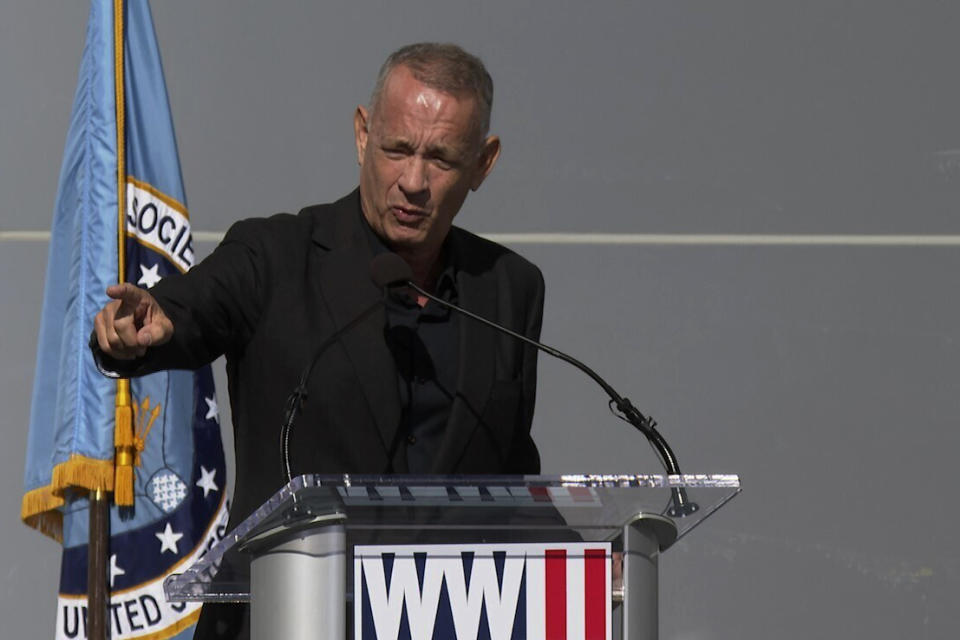 Actor Tom Hanks, a long time supporter of the National WWII Museum in New Orleans, addresses a crowd during opening ceremonies for the museum's new Liberation Pavilion on Friday, Nov. 3, 2023. (AP Photo/Stephen Smith)