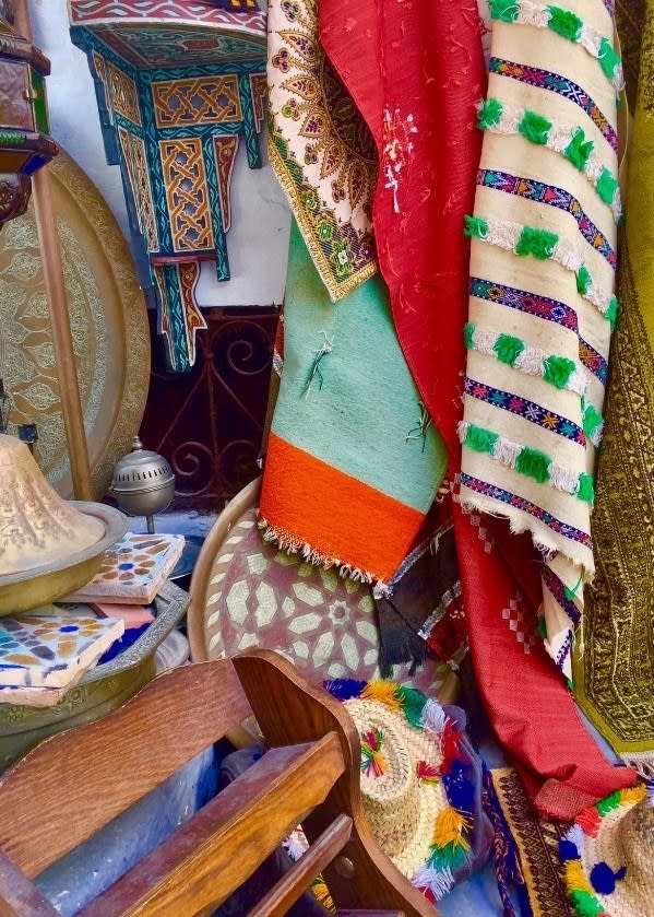 The typical setup in a Tangier Medina shop, bursting with color and items for sale. You often have to sort through the chaos to find hidden gems.