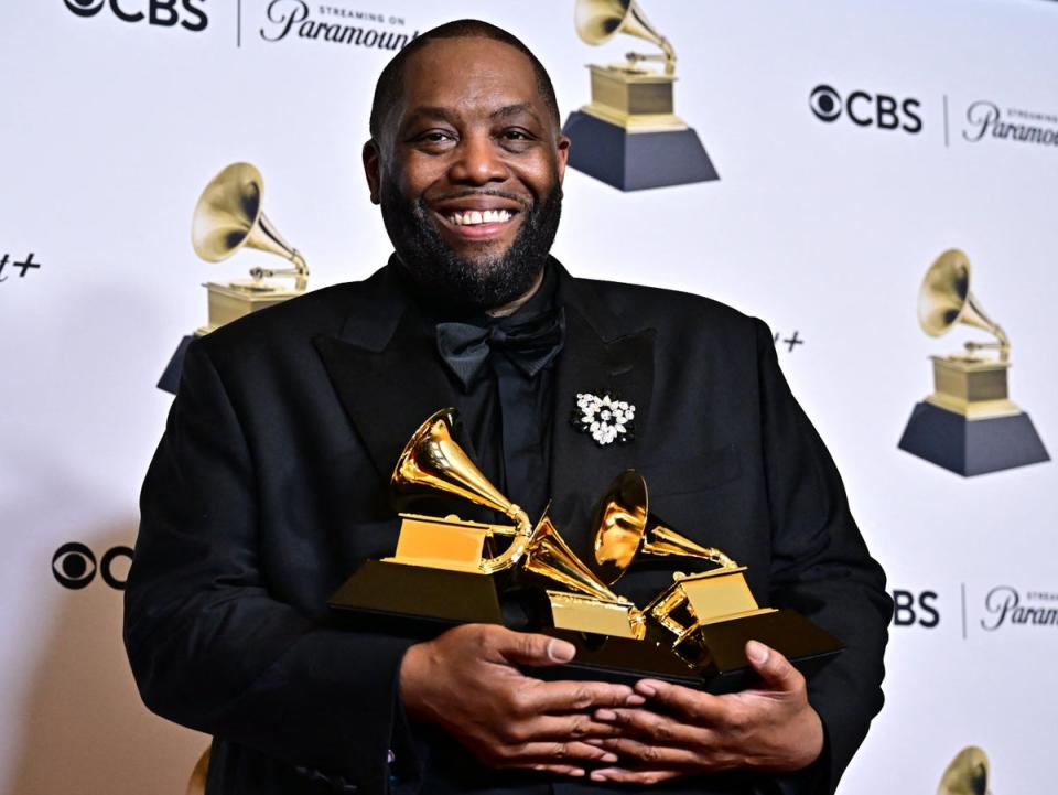 Killer Mike with his three Grammys just before getting arrested (AFP via Getty Images)