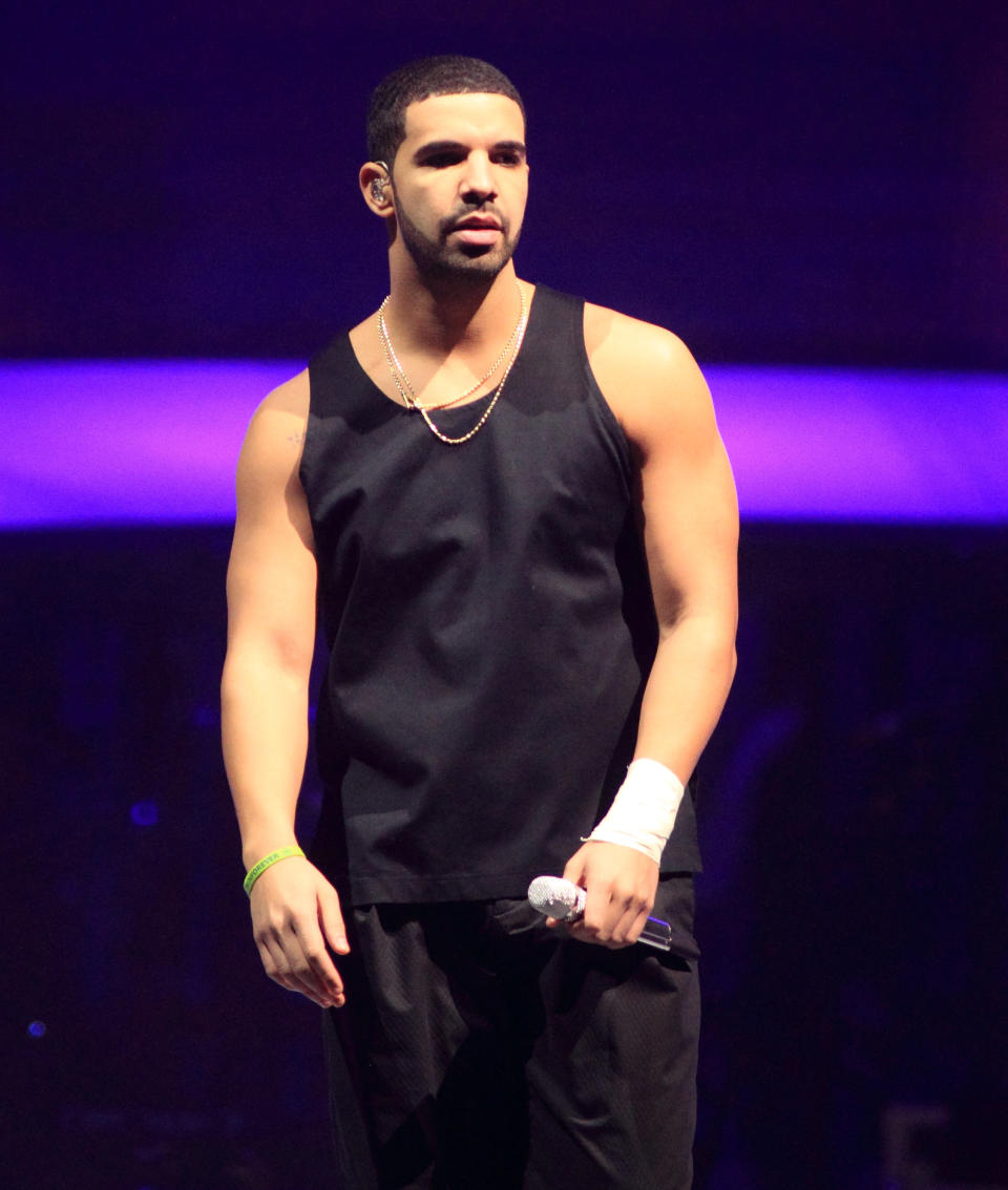 FILE - This Dec. 18, 2013 file photo shows rapper Drake on the last date of his "Would You Like A Tour? 2013" at the Wells Fargo Center in Philadelphia. Drake says he won’t do interviews with magazines following his recent story in Rolling Stone magazine. The rapper was supposed to cover the magazine’s new issue, but was replaced with the late Philip Seymour Hoffman. Drake tweeted Thursday he’s “done doing interviews with magazines.” (Photo by Owen Sweeney/Invision/AP, File)